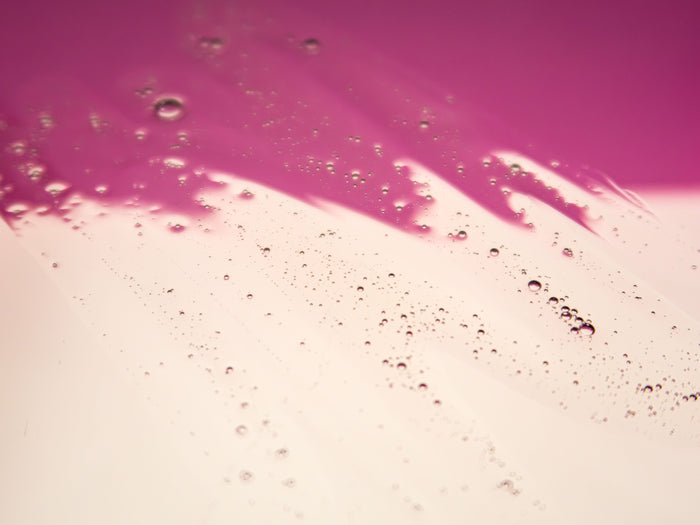 Texture de soin rose étalée
